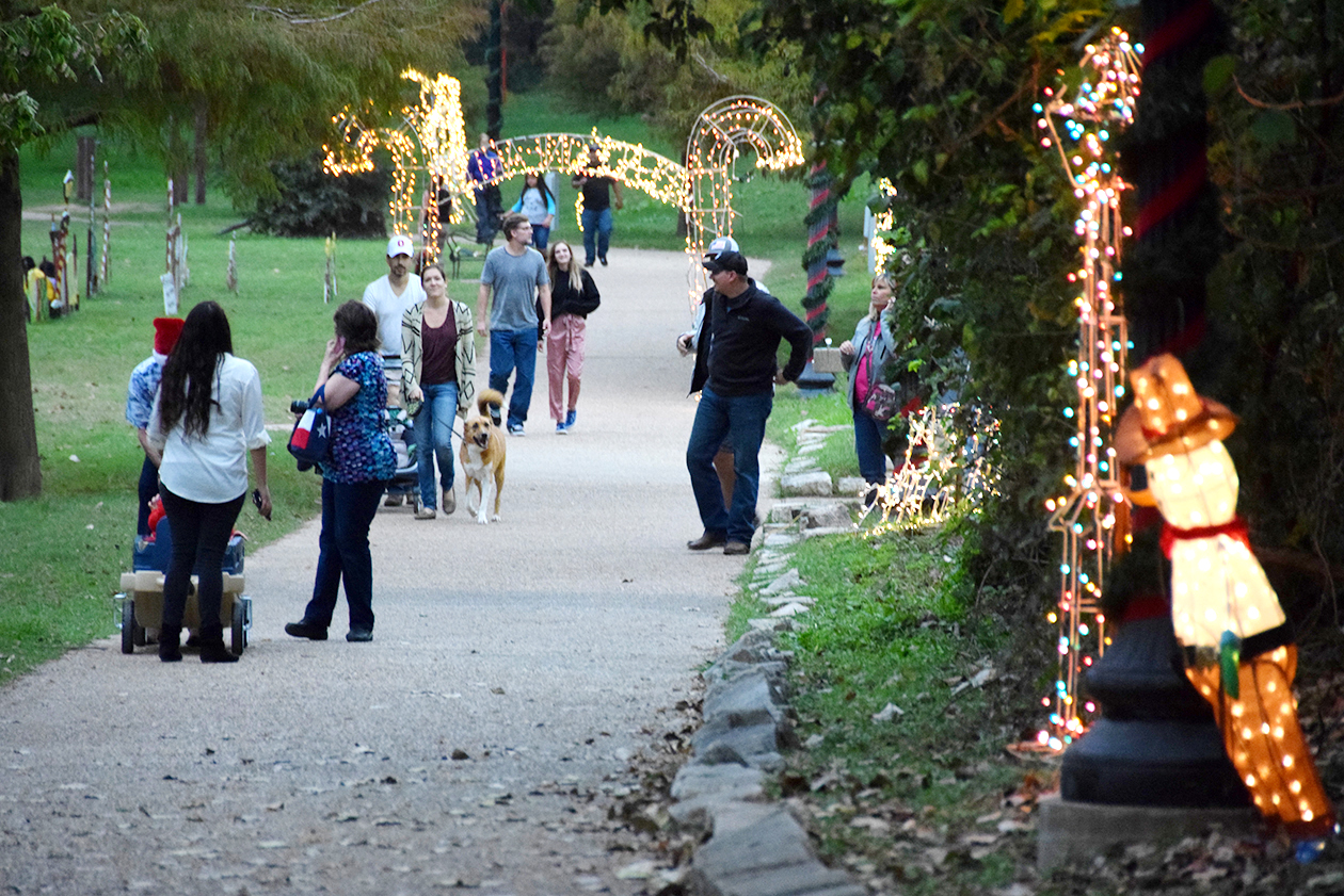 Families enjoy the varied lights at Bastrop's River of Lights along the Colorado River.