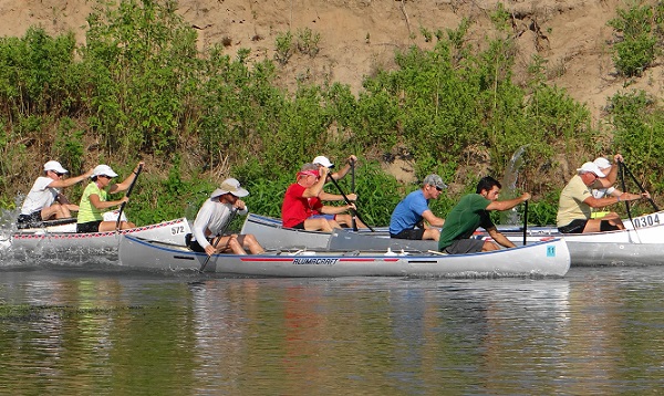 Rowing canoes in a race for the United States Canoe Association.