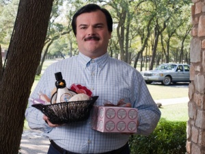 Jack Black as Bernie offering a gift basket.