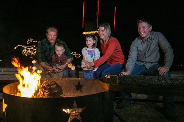 Family roasting marshmallows at McKinney Roughs near Cedar Creek TX