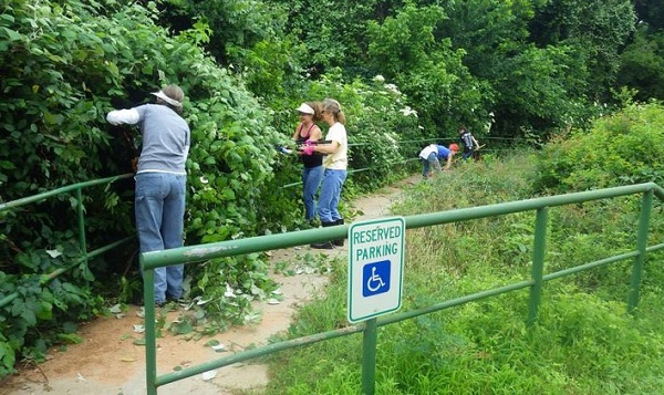 Workers clearing out trails at the Colorado River Refuge in Bastrop, Texas.
