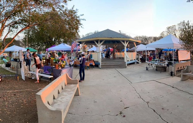 Gazebo with surrounding tents of Farmers selling goods and vegetables